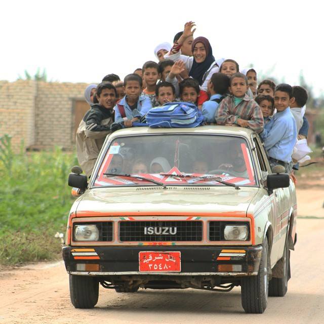 Tens of children returning from school on a pick up truck at a remote village in Qantra Sharq, North Sinai. Photo by Mohamed Ali Eddin