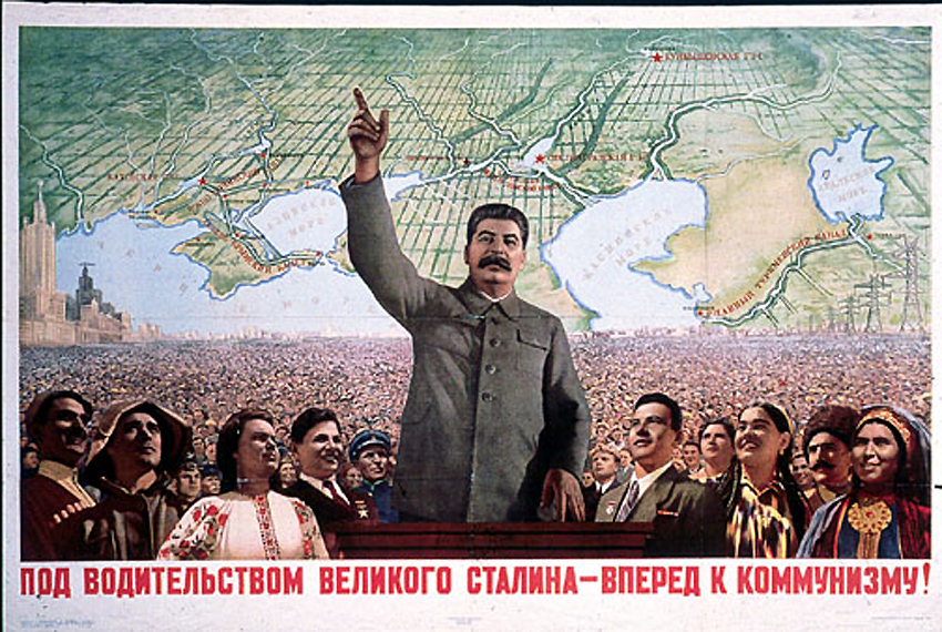 Soviet propaganda poster reads: "Under the Leadership of the Great Stalin - Forward to Communism"