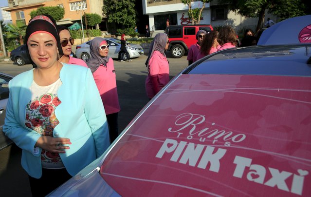 Reem Fawzy, the director of the Pink Taxi company stands in a parking lot with women drivers in Cairo. Credit: Amr Abdallah Dalsh/ Reuters