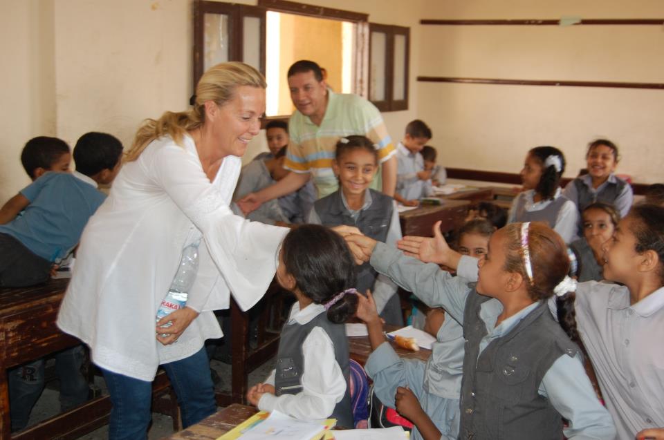 Flavia Shaw-Jackson, founder of FACE pays a visit to children at a school in Obour, Cairo.