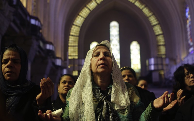 Women pray during a mass lead by Pope Tawadros II. Credit: PA