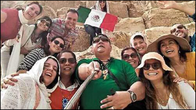 Selfie of the Mexican tourists at what appears to be the Pyramids.