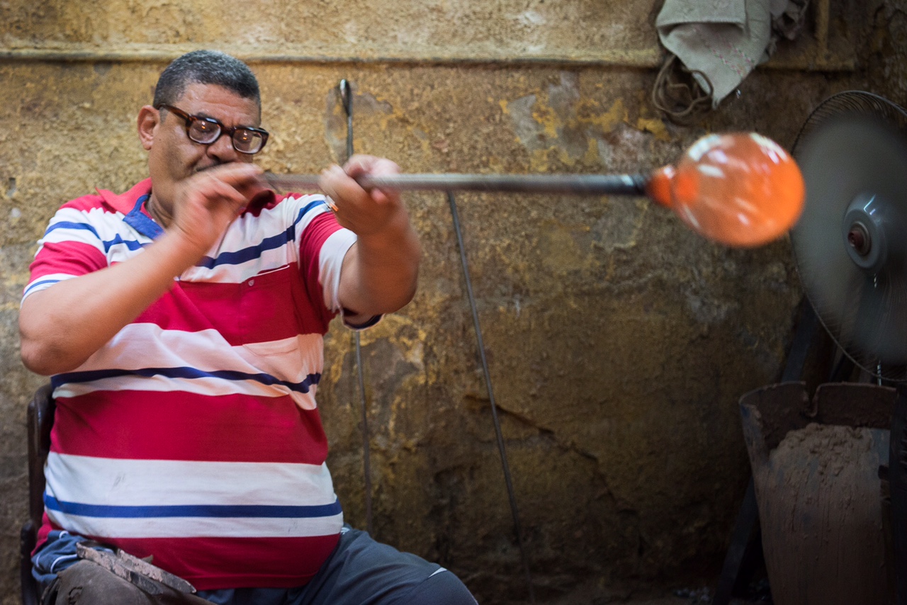 Hassan Ahmed Ali, popular as Hassan Hodhod, one of Egypt's few remaining glassblowers. Credit: Dina Mansour