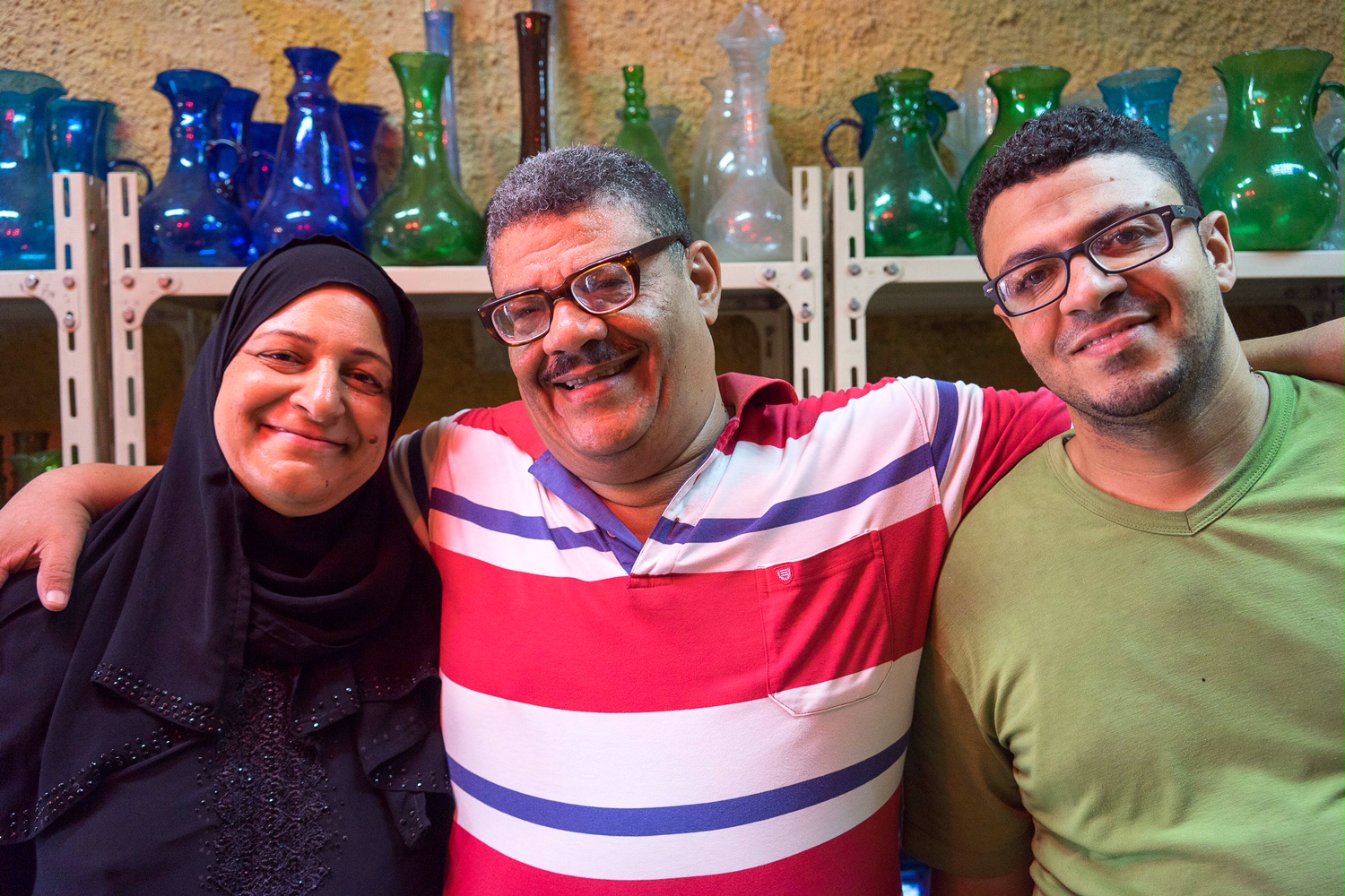 Hassan's wife (left), Hassan (middle), Hassan's son Kamal (right). Besides Hassan and Ahmed, Hodhod's family also take part in glassblowing.