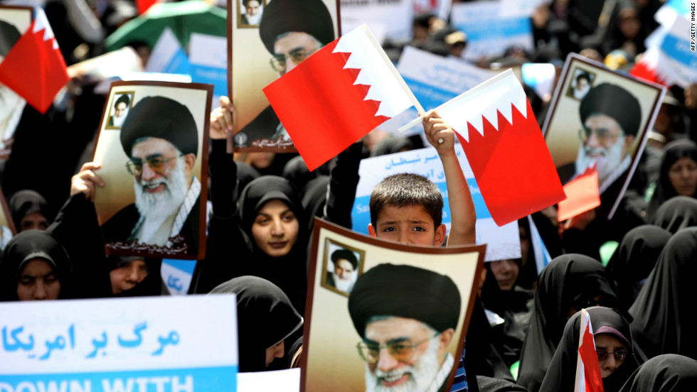 Iranian demonstrators wave Bahraini flags during a protest after the Friday noon prayer in Tehran on May 18, 2012.