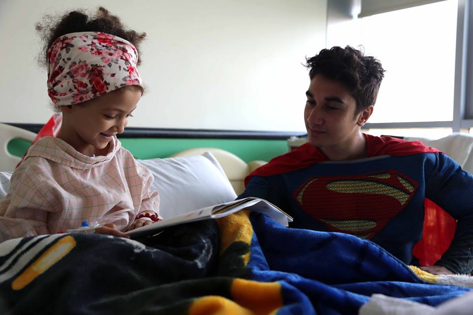 Mohannad spending bringing joy to the children at 57357 during the superheroes' visit to the hospital. Source: 57357 Facebook page