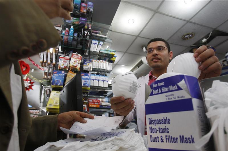 A doctor buys face masks at a pharmacy in Cairo June 9, 2009. Credit: Amr Abdallah Dals/ Reuters