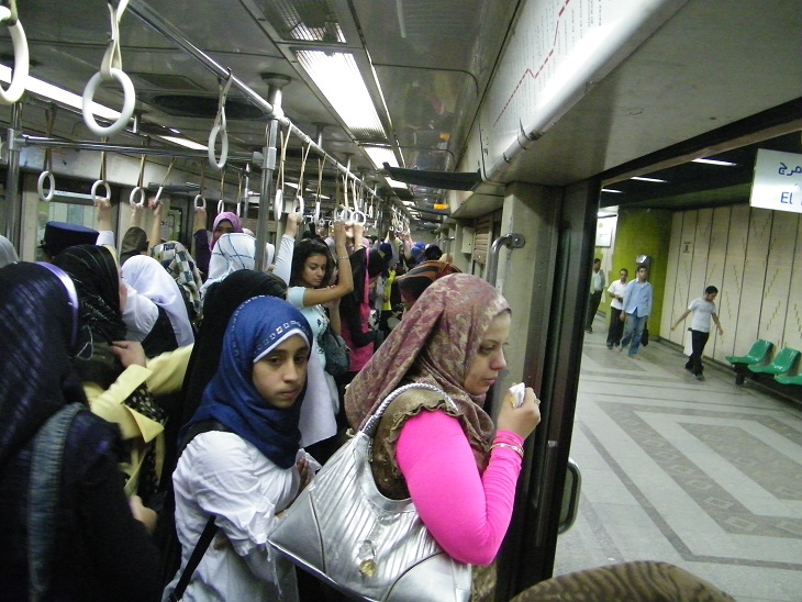 Some metro carts are for women only throughout the entire day (marked with red banners), while others are women-only carts from 9 am till 9 pm (marked with green banners). Source: The Daily News Egypt