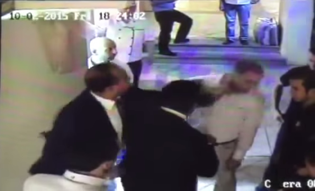 A man to the left of the MP hits El-Sayed in the side of his head at which point several workers of the restaurant step in to try and protect El-Sayyed, but he gets slapped again by a man standing to the right of the MP.