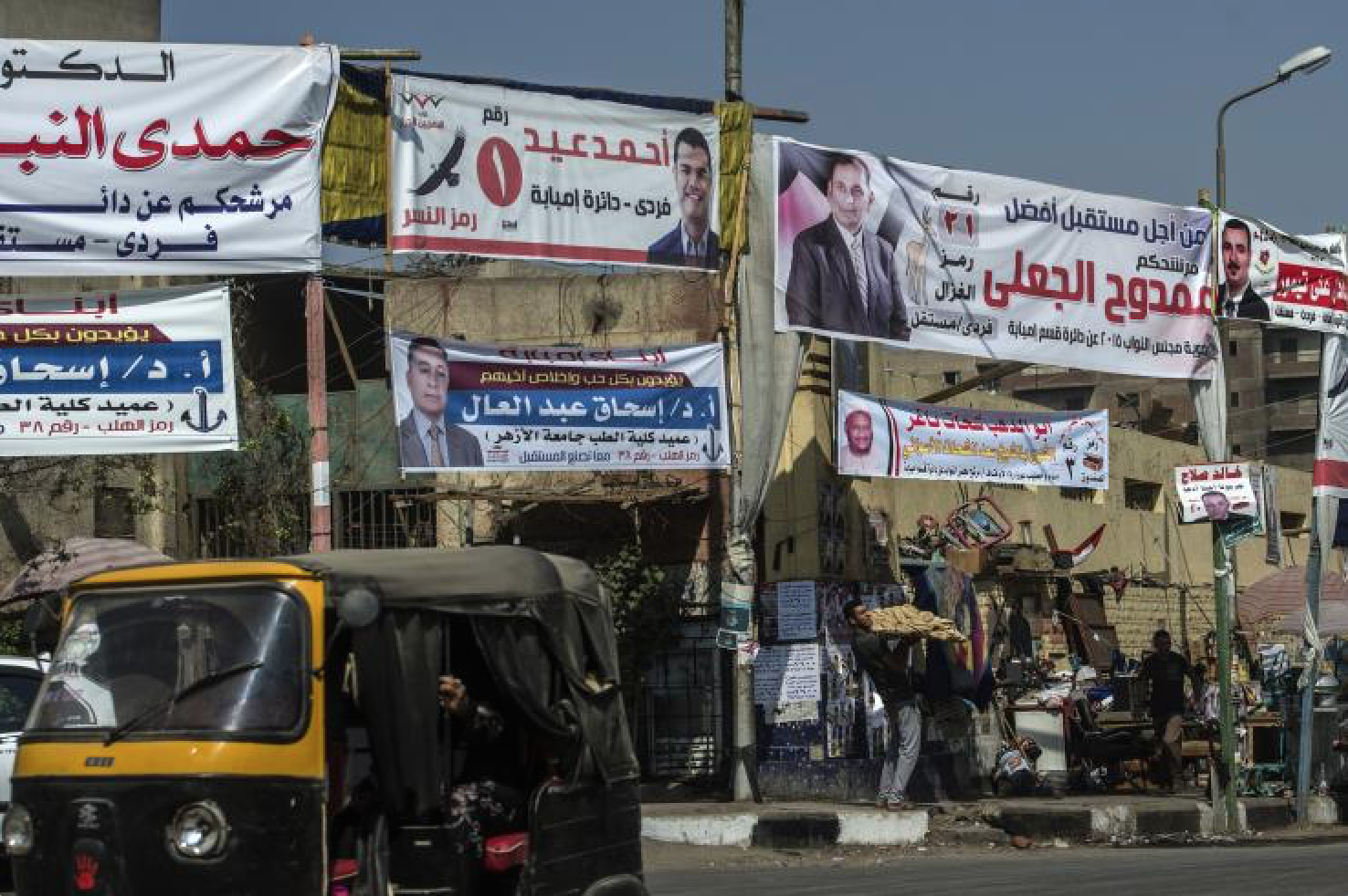 Portraits of candidates for Egypt's long awaited parliamentary elections hang in the Imbaba district of Cairo, on Oct. 15, 2015. Getty Images/AFP/KHALED DESOUKI