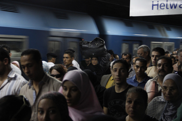Passengers departing the metro at the Shohadaa (Martyrs) station, where the first and second lines intersect. Credit: Heba Elkholy/ AP