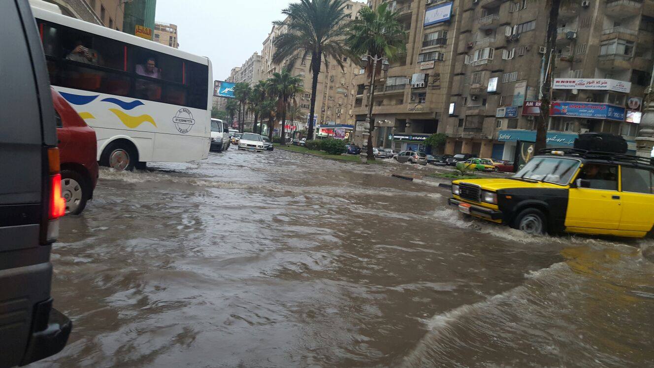 Public transportation making its way through several inches of accumulated rainwater in Alexandria. Photo: Reem Sami Abul Enain