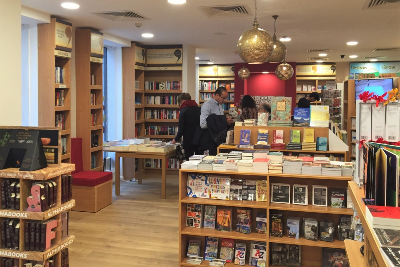 Store visitors exploring the wide array of displayed books. Courtesy of Alef Bookstores