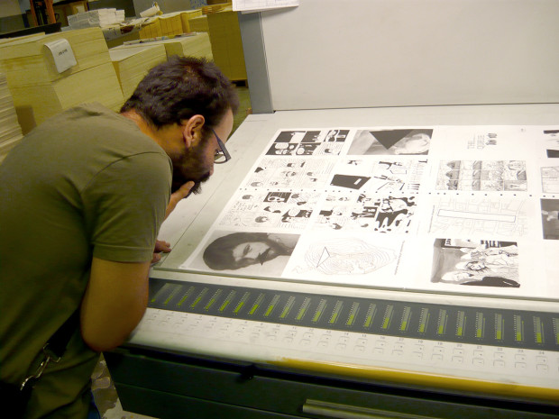 Omar Khouri inspecting the printing