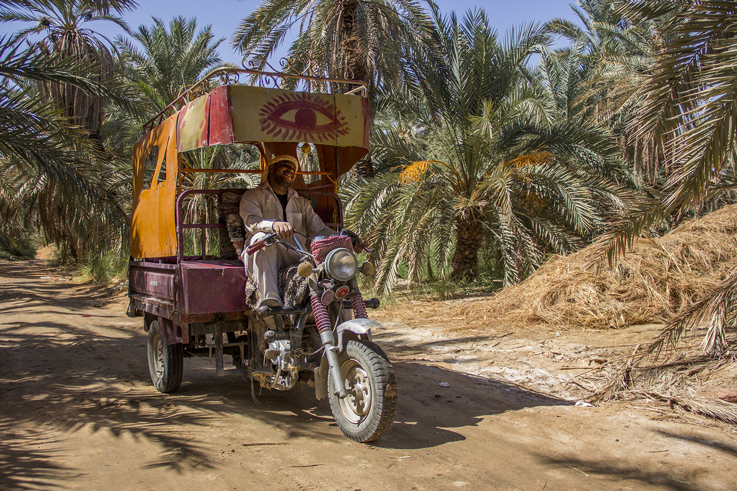 Youssef, one of many tricycle driver around the Oasis