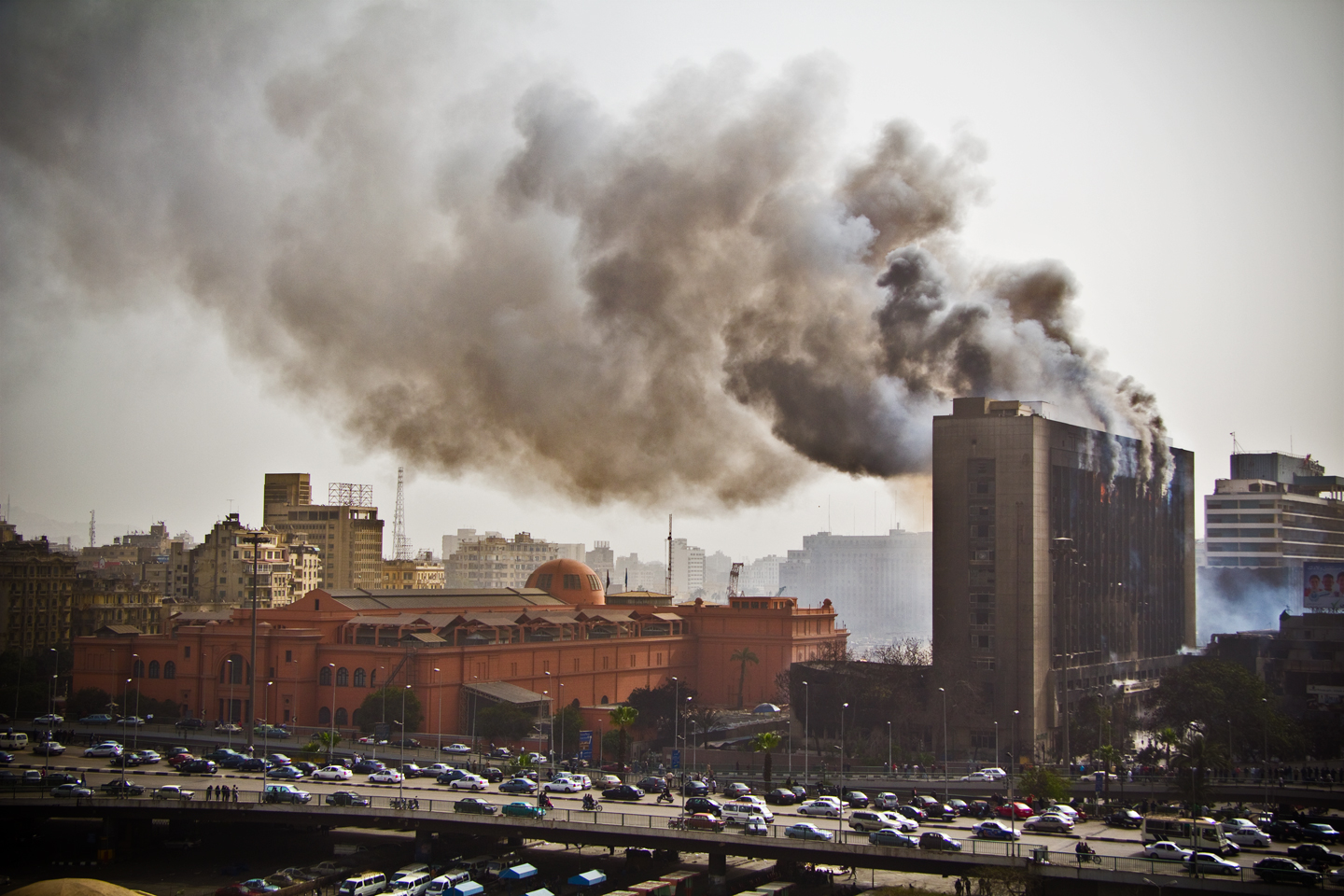 The headquarters of the National Democratic Party, Egypt's ruling political party under Mubarak's rule, burns after being set on fire on January 28, 2011. Photo credit: unkown