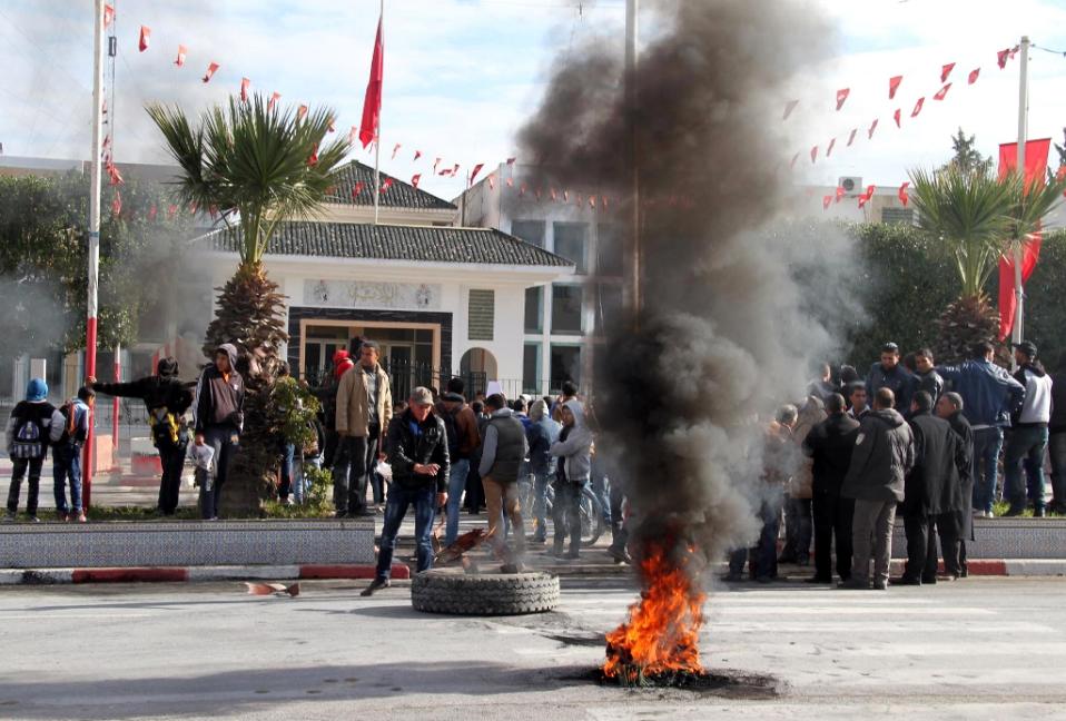 Daily protests and clashes with security forces in the town of Kasserine have followed the death on Saturday of an unemployed man who was electrocuted atop a power pole near the governor's office. Photo: Fawzi Dridi, AFP