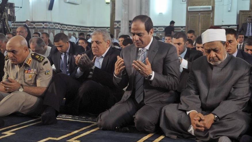A photo released by Egypt’s official Middle East News Agency (MENA) shows Egyptian President Abdulfattah Al-Sisi (second right), the Grand Sheik of Al-Azhar, Ahmed Al-Tayeb (right) and former Prime Minister Ibrahim Mehleb (center). Photo: Associated Press