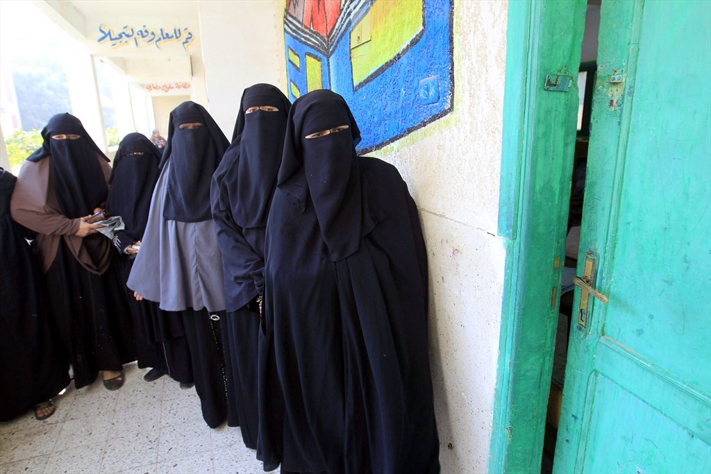 Niqab-clad women line up to vote during a 2014 election. Credit: Mohammed Abed/AFP