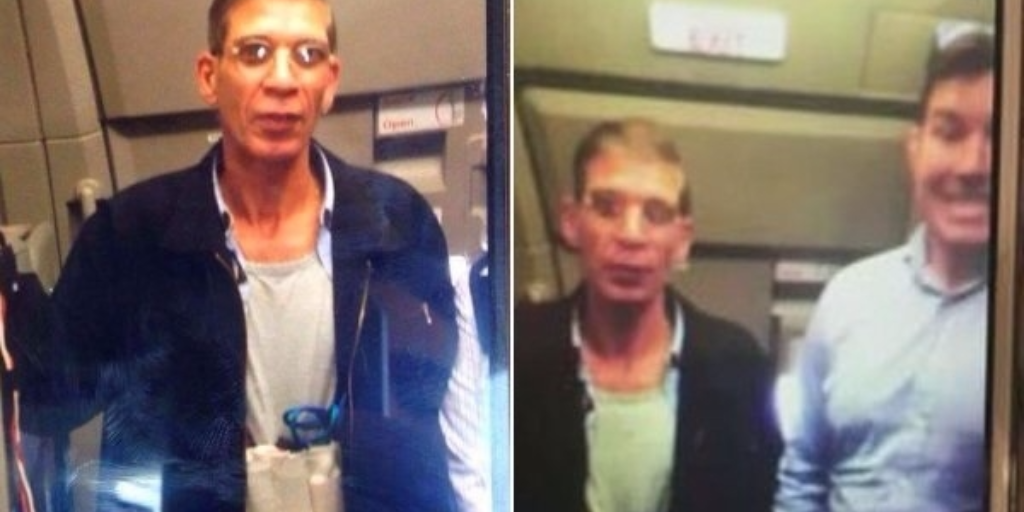 The hijacker takes a photo with a hostage