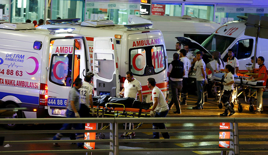 Paramedics push a stretcher at Turkey's largest airport, Istanbul Ataturk, Turkey, following a blast June 28, 2016. (Osman Orsal / Reuters)