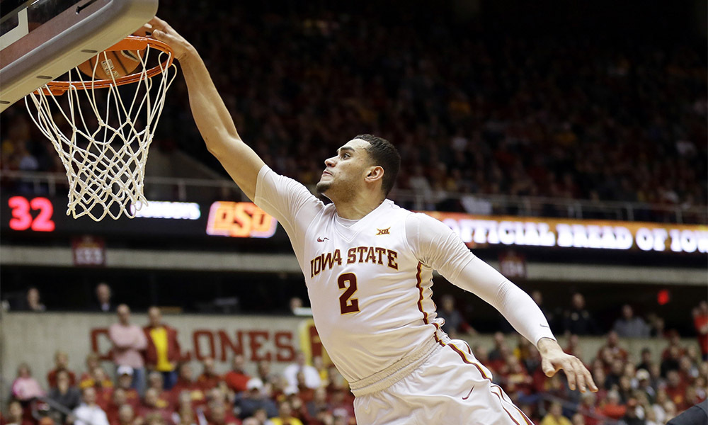 Iowa State forward Abdel Nader (2) dunks over Oklahoma State forward Mitchell Solomon during the second half of an NCAA college basketball game, Monday, Feb. 29, 2016, in Ames, Iowa. (AP Photo/Charlie Neibergall) 