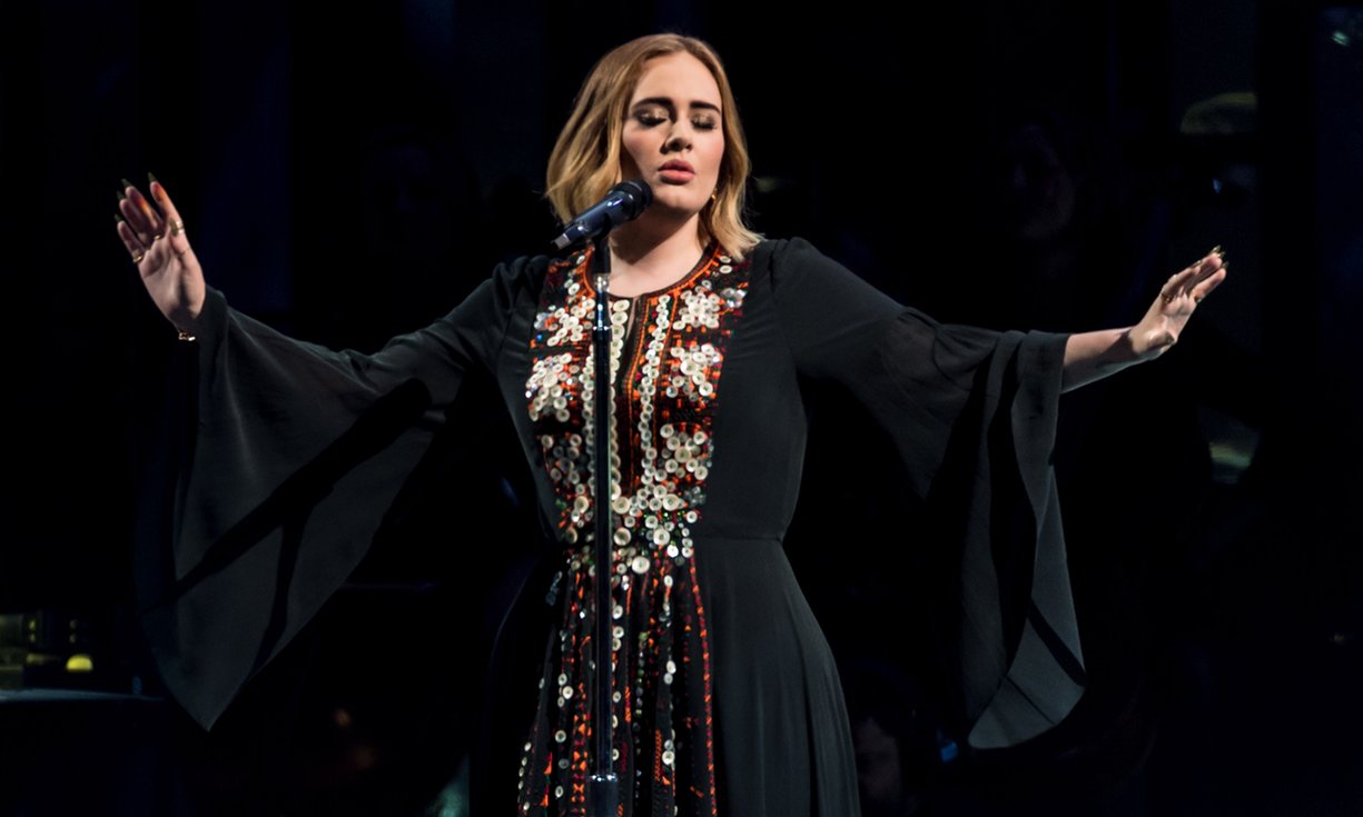 Adele at the Pyramid stage at Glastonbury wearing a Siwa-inspired dress.