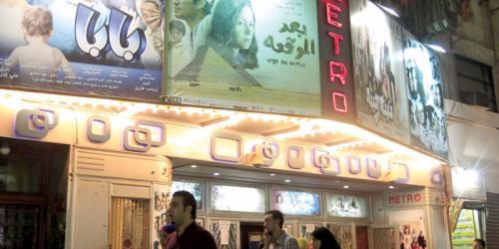 People walk past the Metro cinema in Downtown Cairo, Egypt, on October 16, 2012. (Reuters/Mohamed Abd El Ghany)