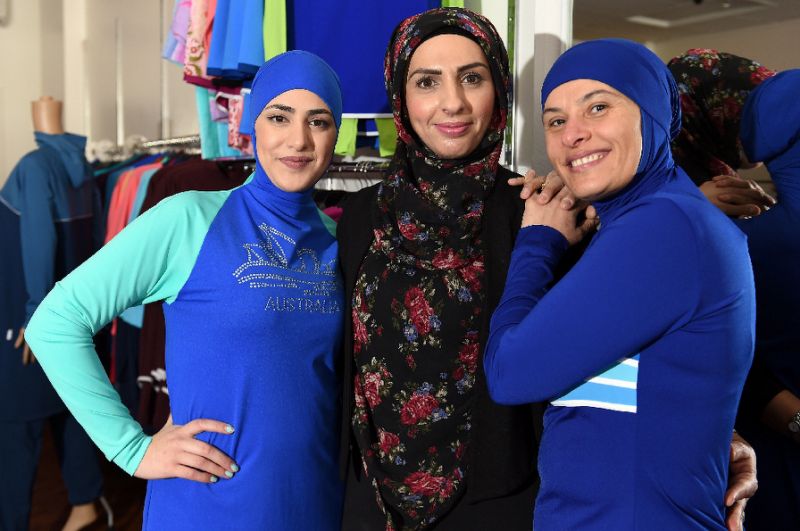 Models show off different burkini styles at a store in Australia