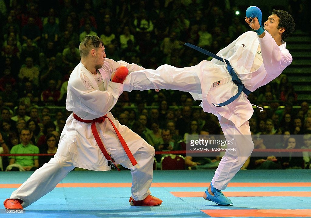 Horuna Stanislav (L) from the Ukraine fights against his opponent Omar Abdel Rahman from Egypt during the Male Kumite third place 75kg of the 22nd Karate World Championships at OVB-Arena on November 8, 2014 in Bremen, Germany. Photo: CARMEN JASPERSEN/AFP/Getty Images