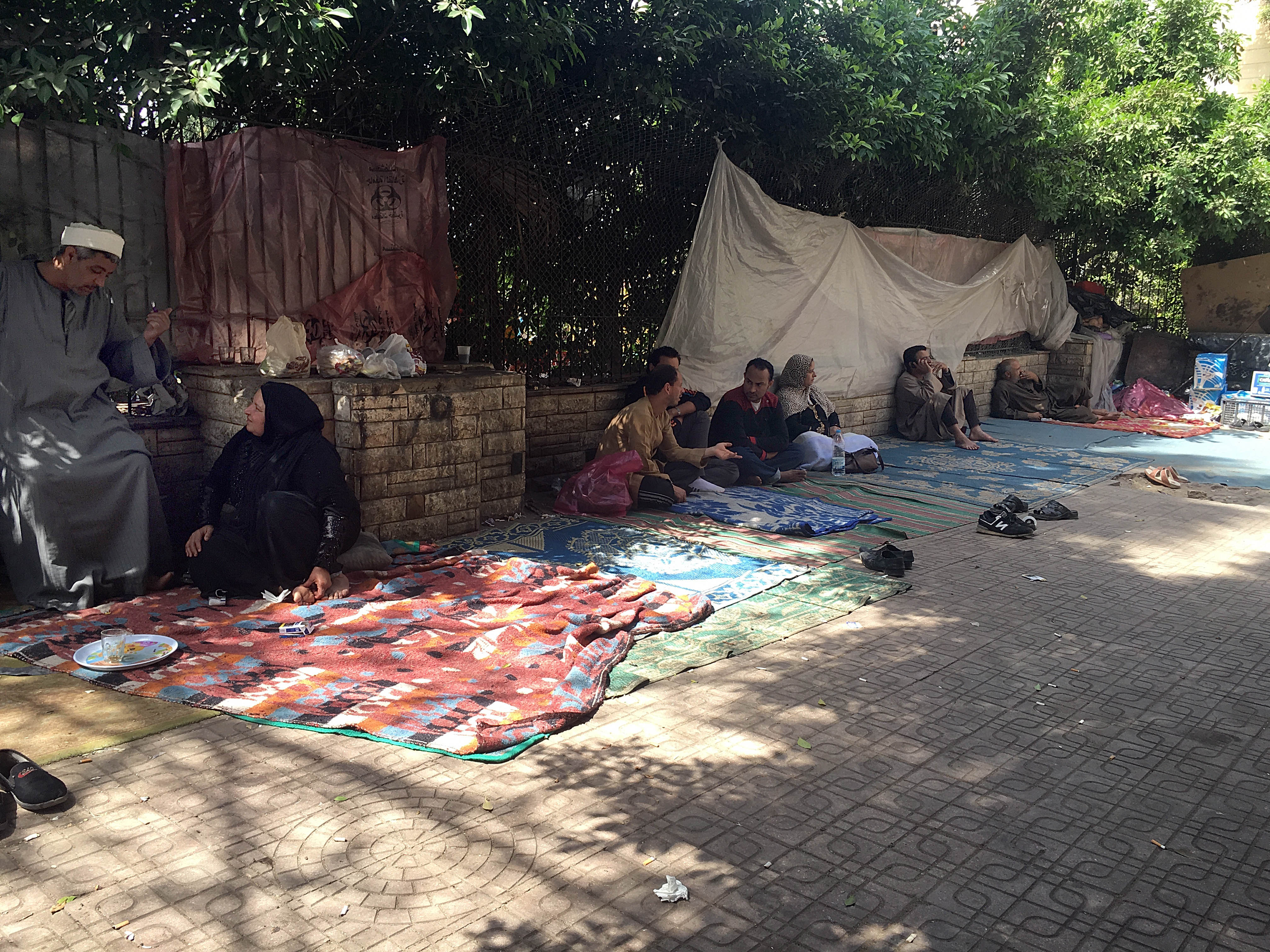 Patients and their relatives waiting outside Qasr al-Ainy Hospital. Photo: Roger Anis