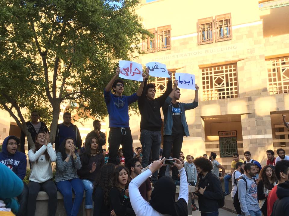 Students at the American University in Cairo hold up signs that read "My father is not a thief" during a protest against rapidly increasing tuition fees. Photo: Nouran Allam