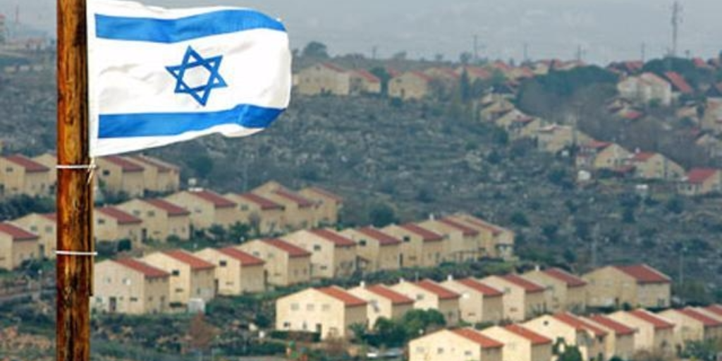 The Israeli flag flying over Israeli settlements in the West Bank (Photo: Reuters)