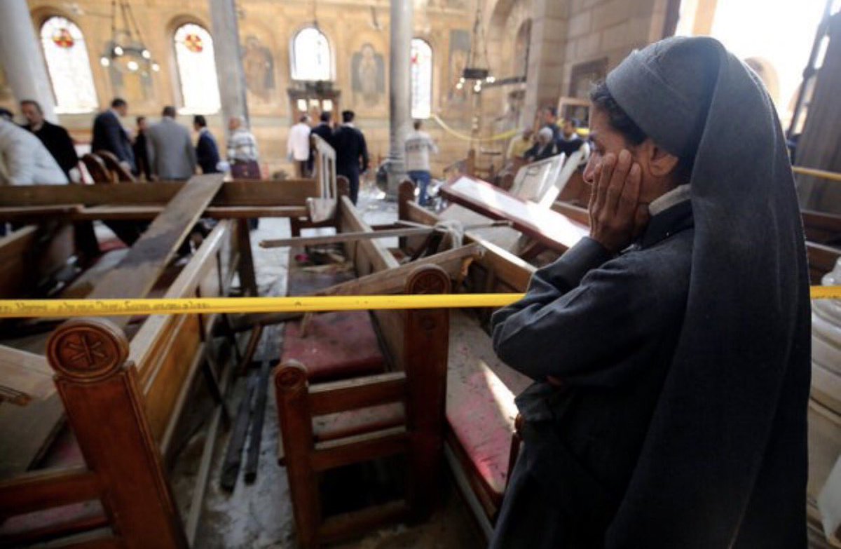 A nun cries as she stands at the scene inside Cairo's Coptic cathedral, following a bombing, in Egypt December 11, 2016. REUTERS/Amr Abdallah Dalsh