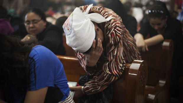 An Egyptian Coptic Christian woman prays in a church within Al-Mahraq Monastery in Assiut, Upper Egypt, Aug. 6, 2013. Photo: AP