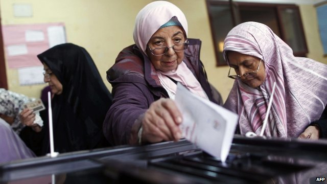 Women line up to cast their vote in 2012.