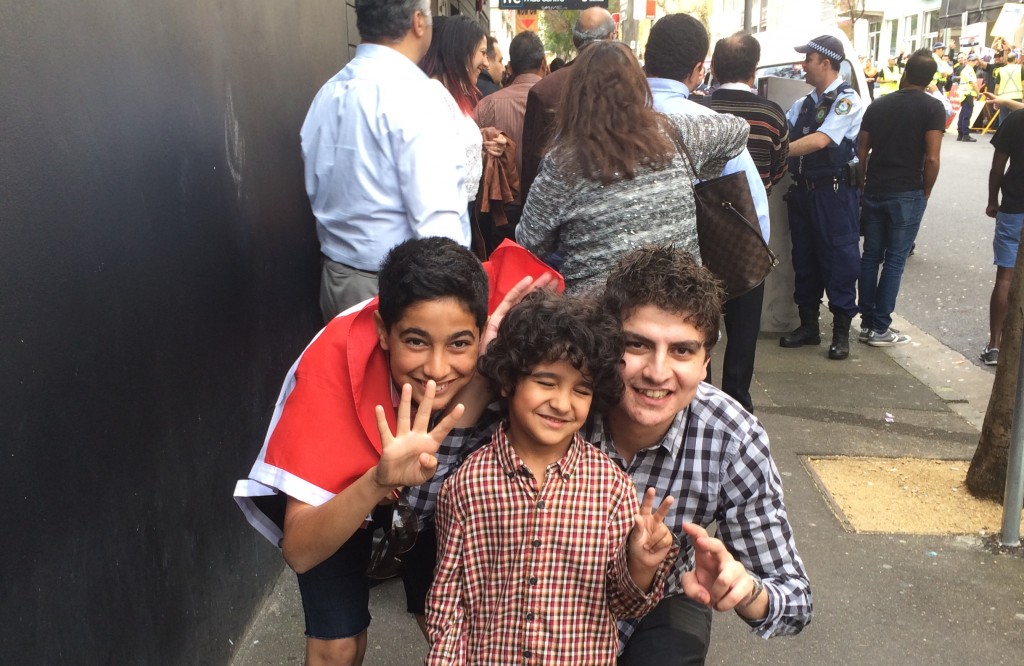 Children pose outside the consulate in Sydney. Credit: Anthony Hanna