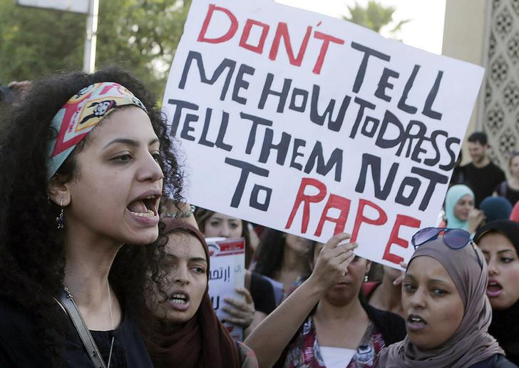 Women chant slogans as they gather to protest against sexual harassment in front of the opera house in Cairo June 14, 2014. Asmaa Waguih/ Reuters