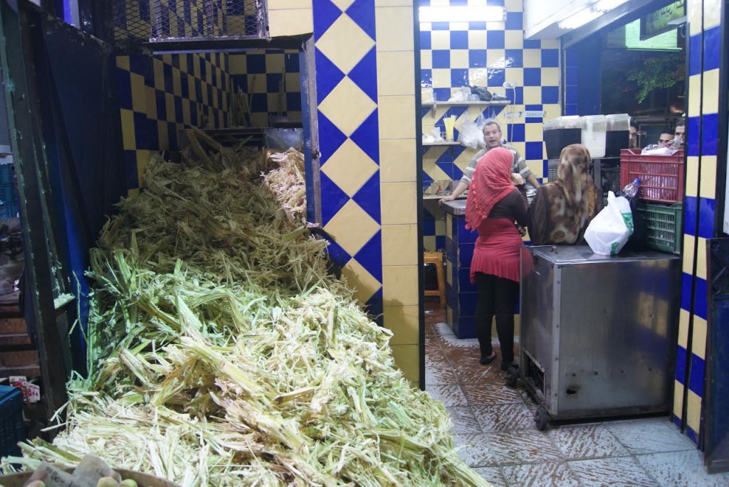 Dehydrated sugar cane overflows from the back of the juice shops where they extract the juice.