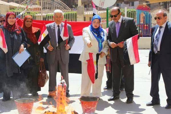 Bothaina Keshk supervising the burning of the books.