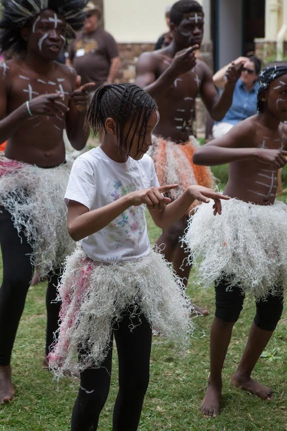 Students from AHLC performing a traditional African dance routine. Throughout the day, students from the AHLC performed routines and displayed costumes representing various African nations to entertain those attending the food fair.