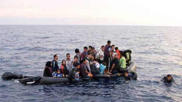 Undocumented migrants on a rubber boat in the Aegean sea. Credit: Reuters