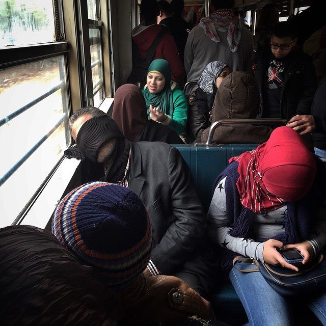 Sleeping by the window on the Metro in Cairo. Photo by Pan Chaoyue