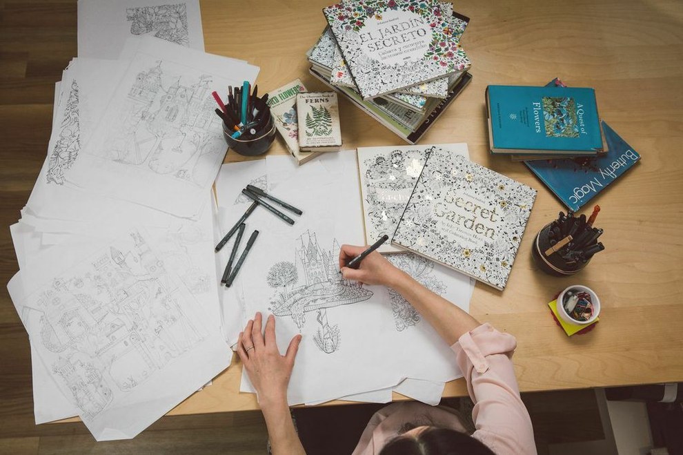 Johanna Basfor, 'Queen of Coloring', at work while designing her color books. Courtesy of Johanna Basford and Laurence King