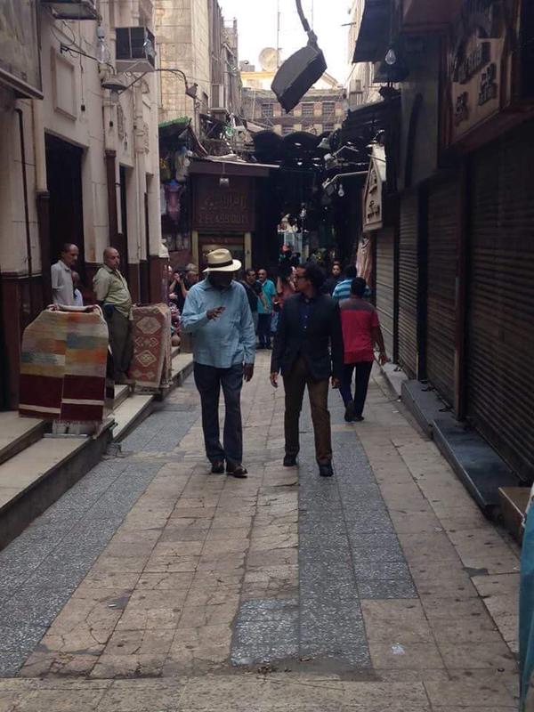 Freeman an crew member at Old Cairo's al-Moez Street in preparation for the National Geographic documentary 'The Story of God'