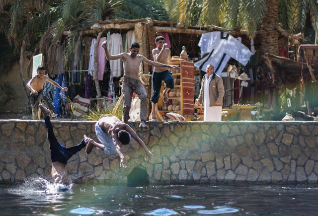 Boys enjoying a swim at the Joba mineral spring. Credit: Enas El Masry