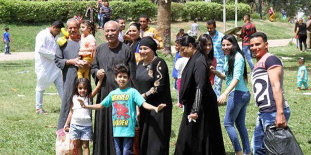 A family enjoys an excursion at Al-Orman Park. Photo: The Cairo Post