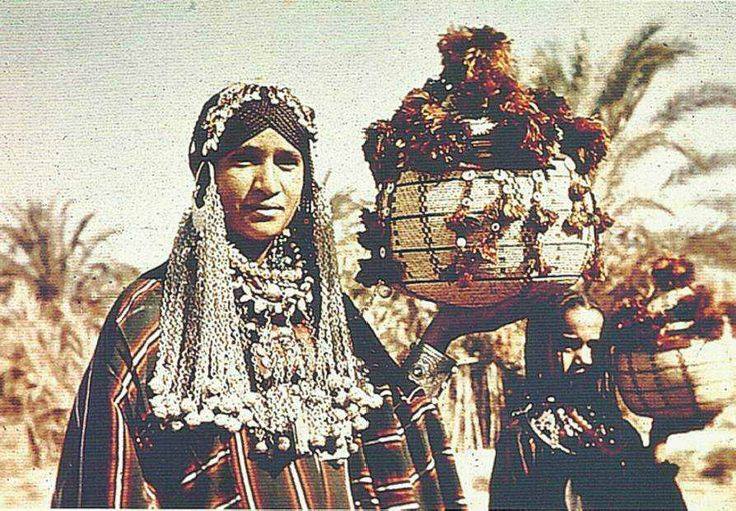 Siwan woman and girl dressed in traditional everyday garments and silver jewelry (Credit unknown)