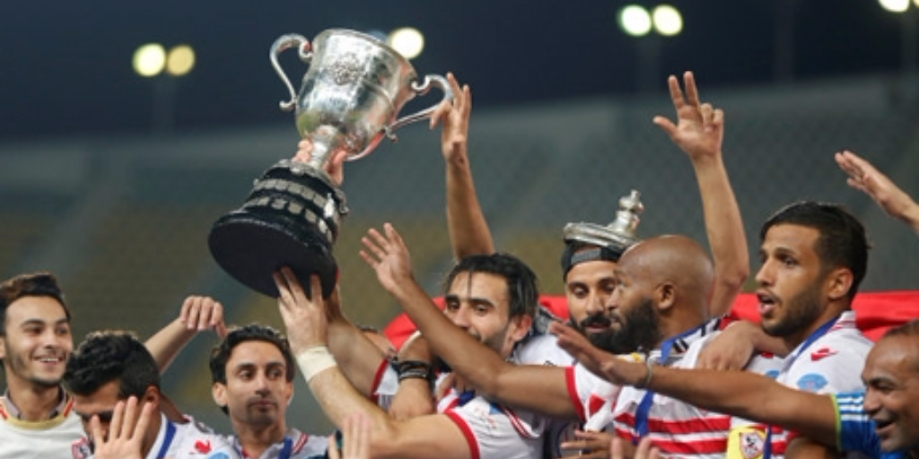  The image shows the Zamalek football team celebrating their victory and remaining undefeated during the 2018–19 Egyptian Premier League season.