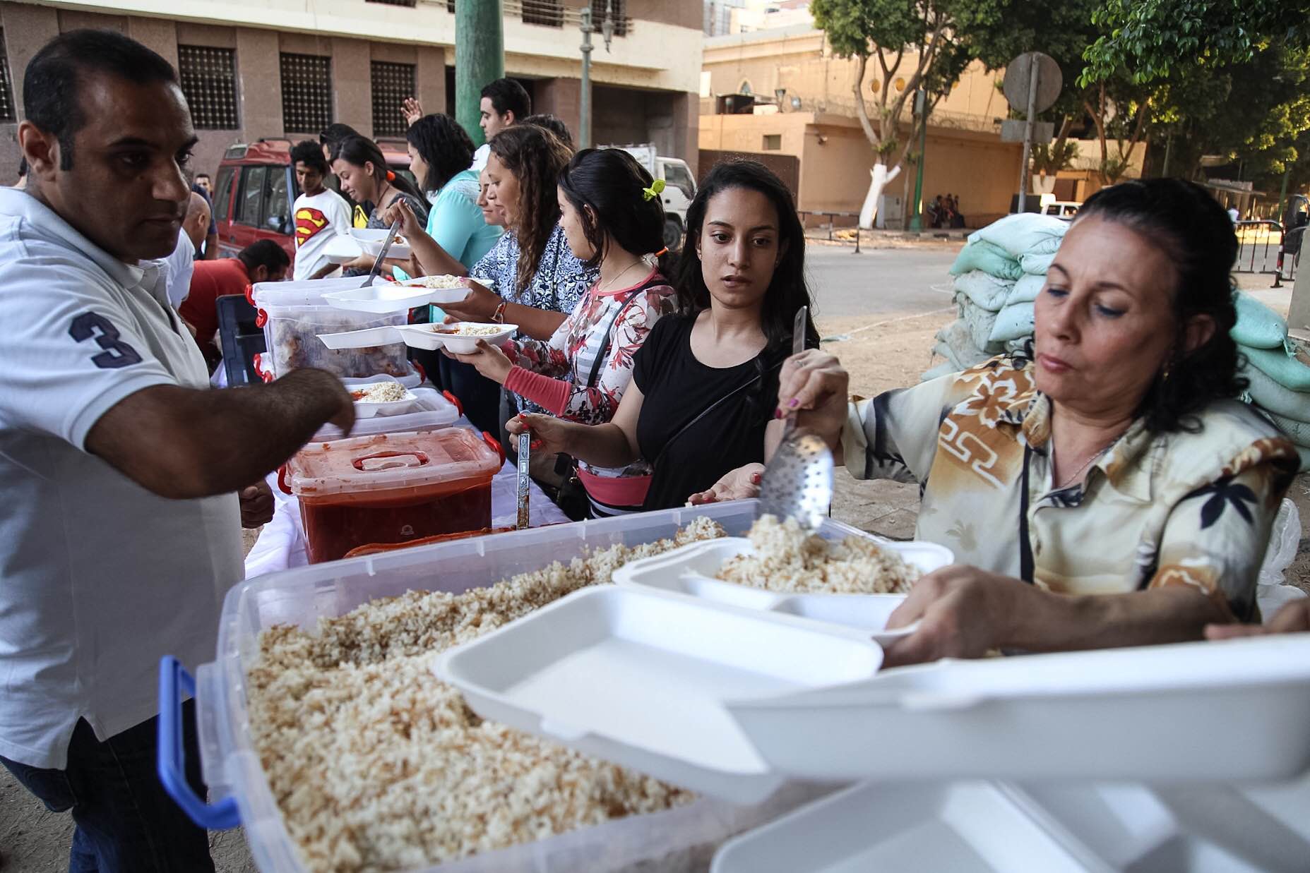 woman donating charity during ramadan in Egypt